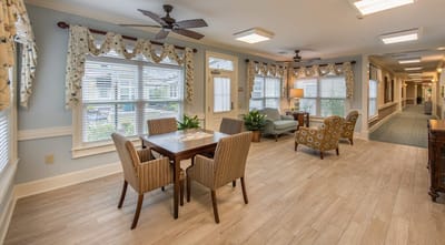 Bright common area with seating and tables