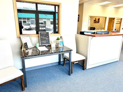 Welcoming reception area with a desk and seating