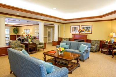 Bright common area with seating and floral arrangements
