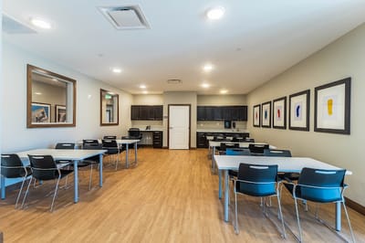 Bright common area with tables and chairs