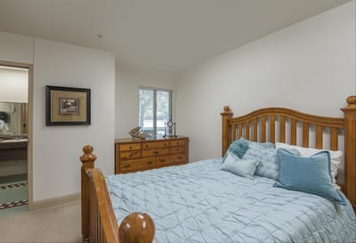 A well-furnished private resident room with a bed