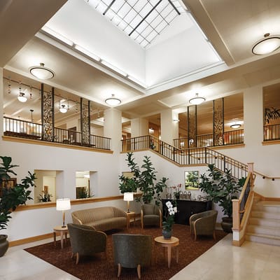 Bright and inviting lobby area with seating and plants