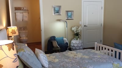 Cozy private resident room with floral bedding