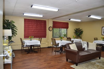 Bright dining area with tables and chairs in a common space
