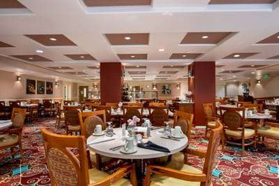 Dining area with tables set for meals