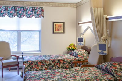 Two patient beds in a shared room setup