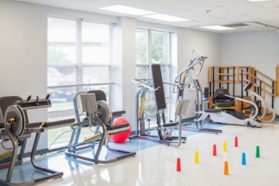 Exercise equipment in a bright activity room