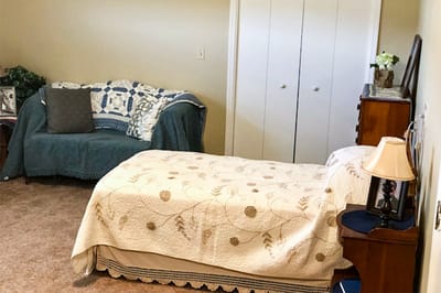 Cozy private resident room with a bed and couch