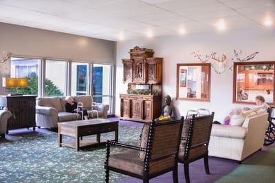 Common area with residents relaxing and chatting