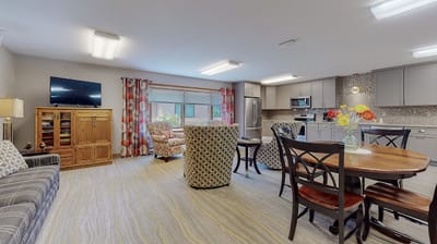 Bright and inviting common area with seating and a kitchen