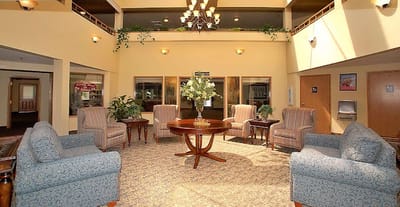Bright common area with comfortable seating and plants