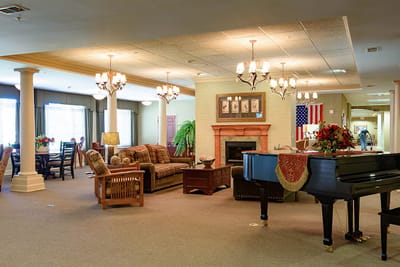 Cozy common area with seating and piano