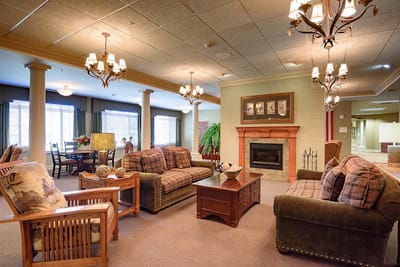 Cozy common area with sofas and a fireplace