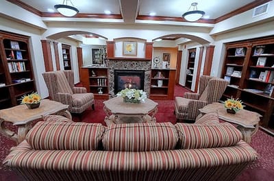 Comfortable common area with seating and bookshelves