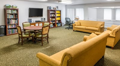 Common area with couches and bookshelves