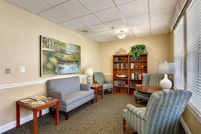 Cozy common area with seating and bookshelves
