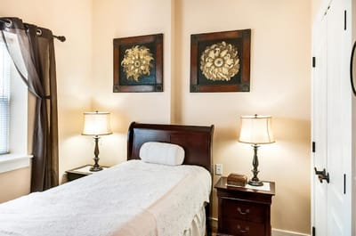 Cozy private room with bed and decor