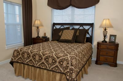 Well-furnished bedroom in a senior living facility