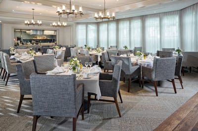 Dining room with elegantly set tables and modern decor