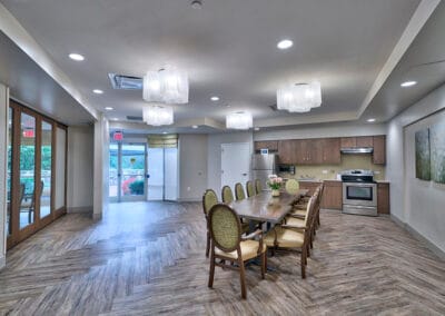 Maplewood Park Place, Nursing Home in Bethesda, MD — Bright dining area with a long table and chairs