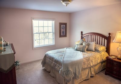 Cozy private bedroom with a bed and window