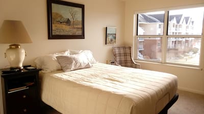 Comfortable private resident room with a bed and window