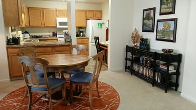 Cozy dining area with a table and paintings