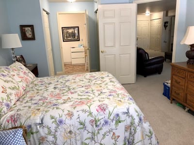 Cozy resident room with floral bedding and light decor