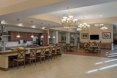 Dining area with seating and decorative lighting