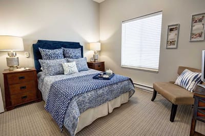 Cozy private resident room with bed and decor