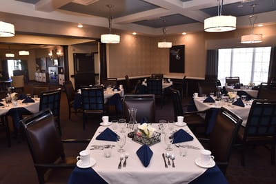 Well-set dining area with tables and chairs