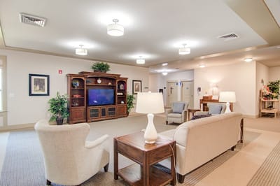 Bright common area with seating and entertainment