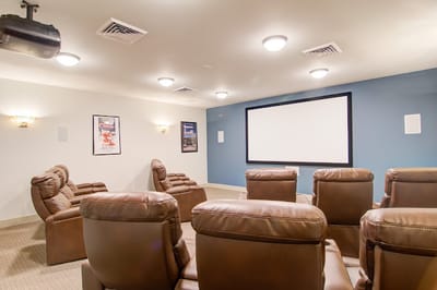 Comfortable seating in a private movie theater room