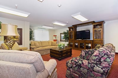 Cozy common area with seating and entertainment center