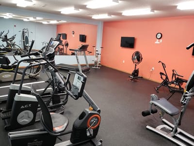 Interior view of an exercise room with fitness equipment