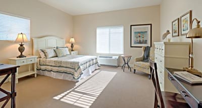 Well-furnished resident room with natural light