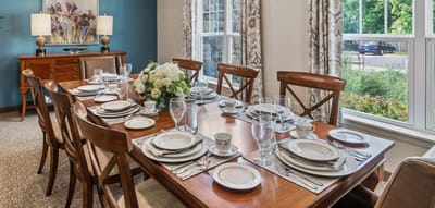 Beautifully set dining table in a common area