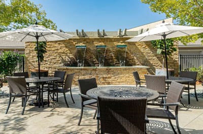 Outdoor seating area with a water feature