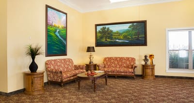 Bright interior lounge area with colorful paintings