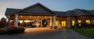 Exterior view of Shiloh Health and Rehab entrance at dusk