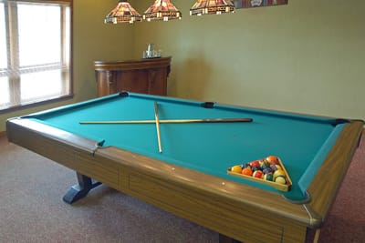 Interior view of a pool table with ambient lighting