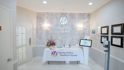 Reception area with flowers and facility branding