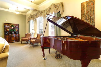 Interior view of a common area with a piano