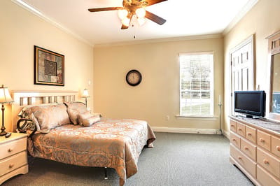 Cozy bedroom with a decorative bedspread and natural light