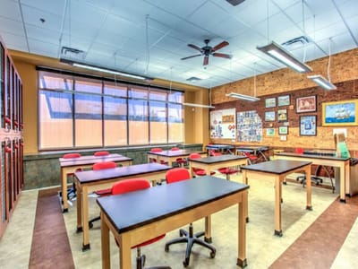 Bright activity room with tables and chairs