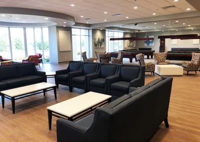 Bright common area with modern seating and decorations