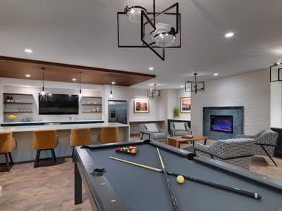 Interior view of a cozy lounge area with a pool table