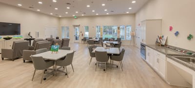 Bright common area with tables and chairs