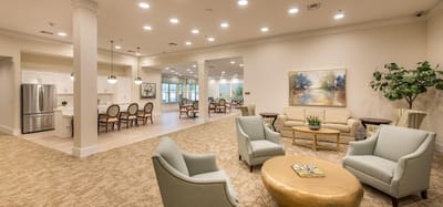 Bright common area with comfortable seating and art