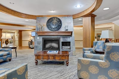 Cozy common area with chairs and a fireplace